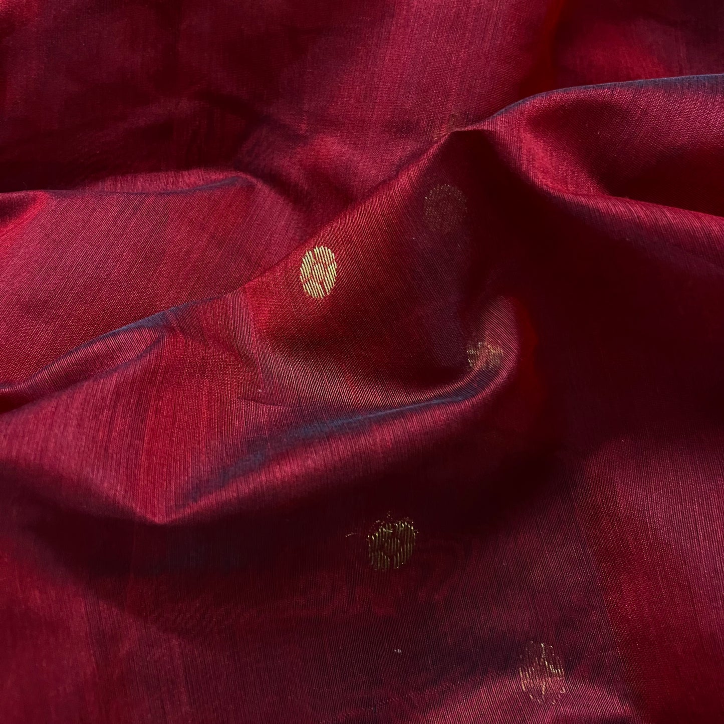 Deep maroon Chanderi saree with zari bootis all over and flower motifs on pallu