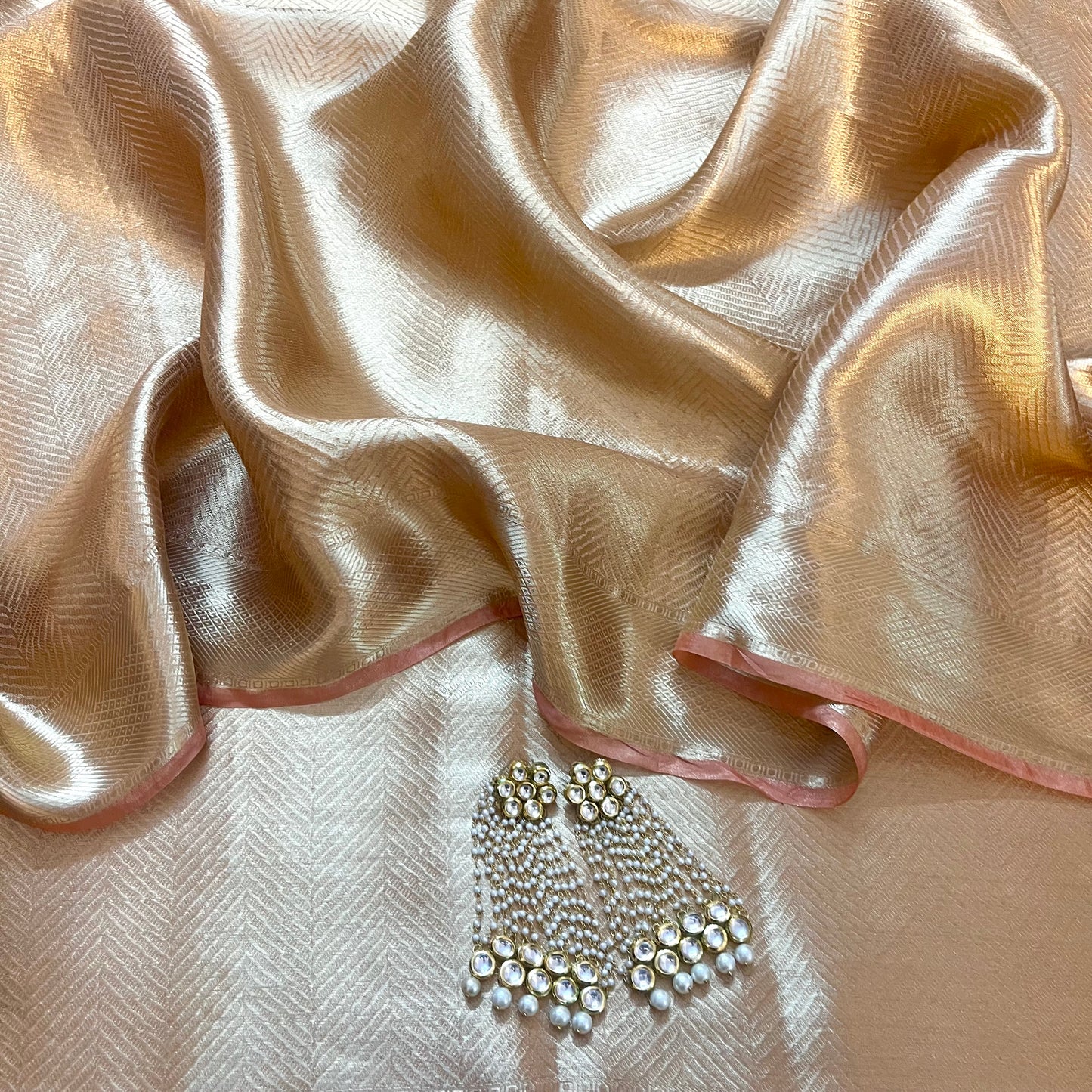 Champagne gold Banarasi silk saree with zari pattern all over