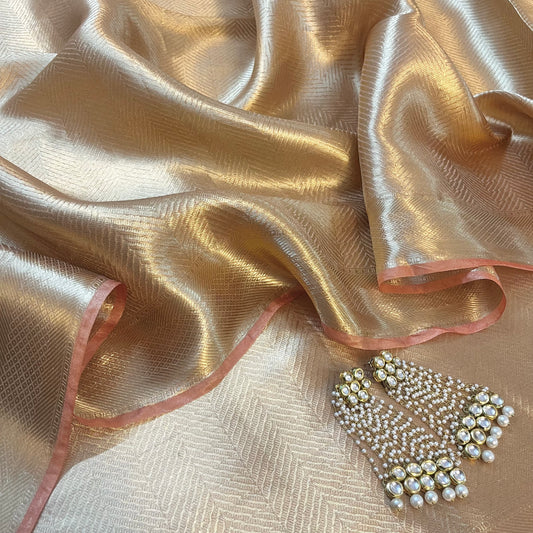 Champagne gold Banarasi silk saree with zari pattern all over