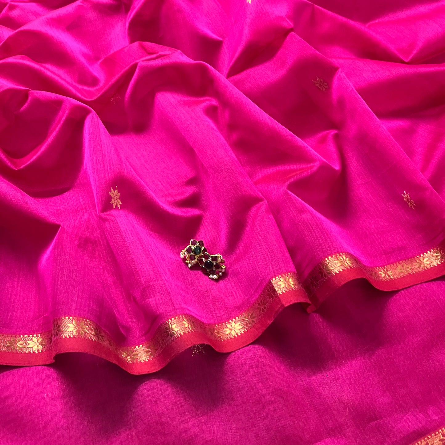 Pink Maheshwari saree with flower bootis all over