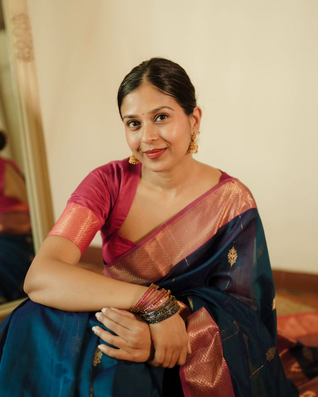 Peacock blue and pink Maheshwari saree with zari motifs all over