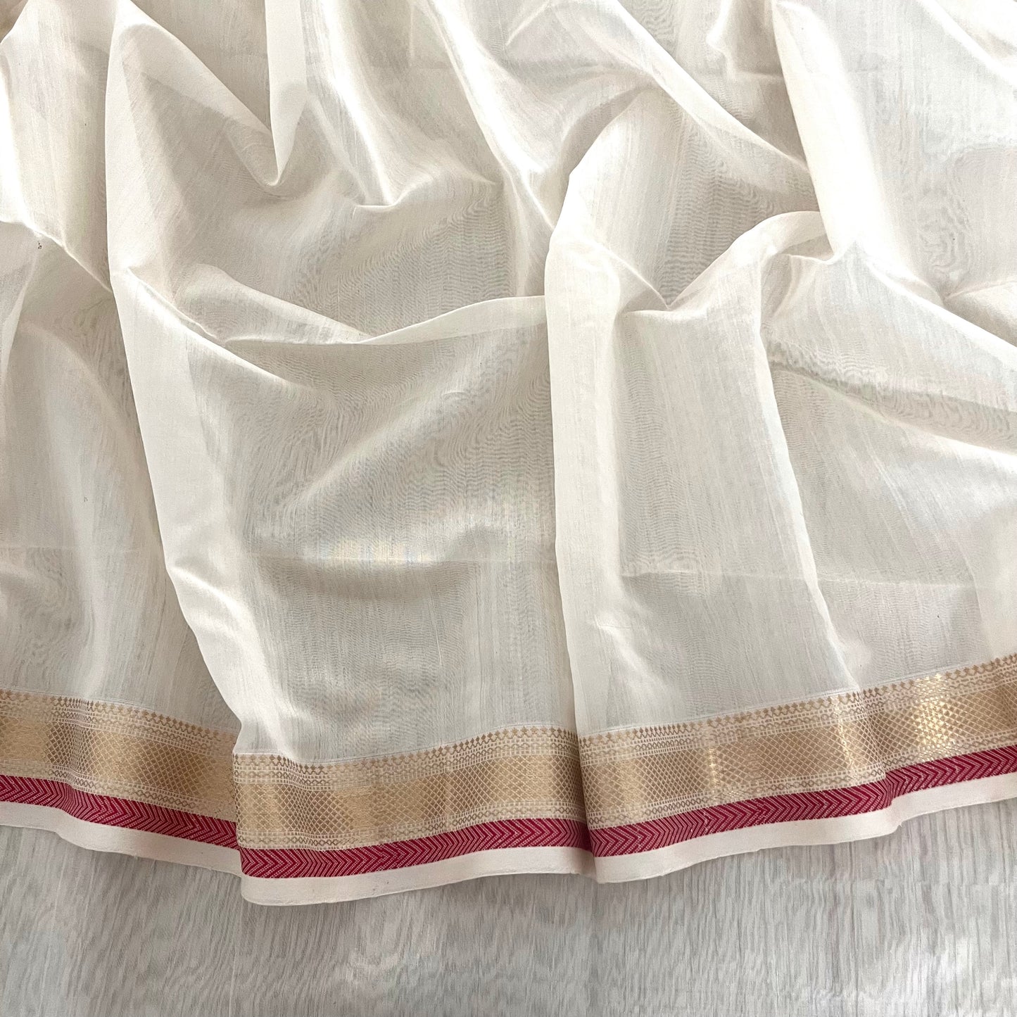 White and red Maheshwari saree with zari border