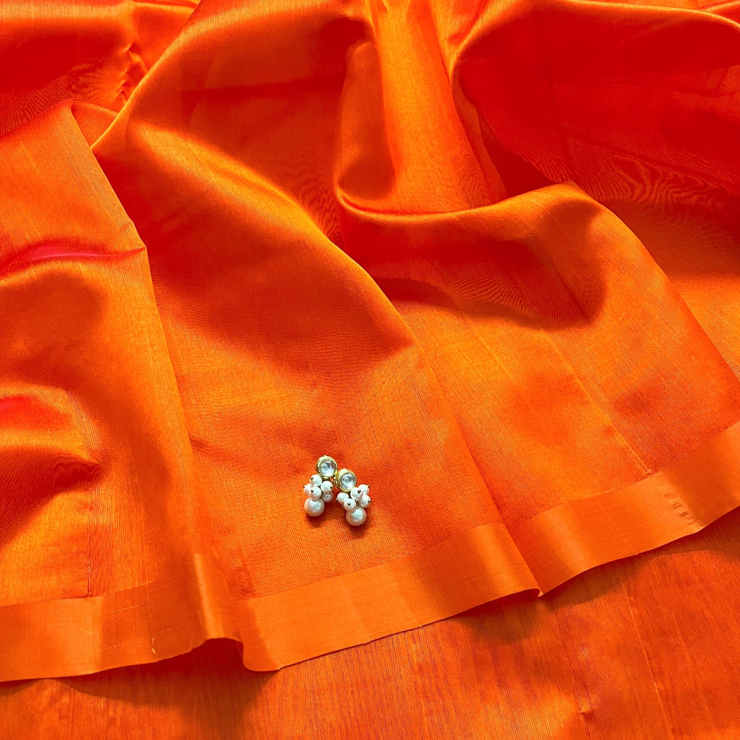 Sunset orange chanderi silk saree with silk border