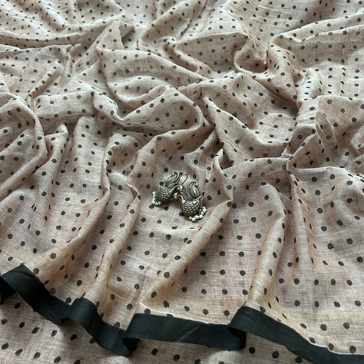 Greyish beige and black polka dot mulmul saree
