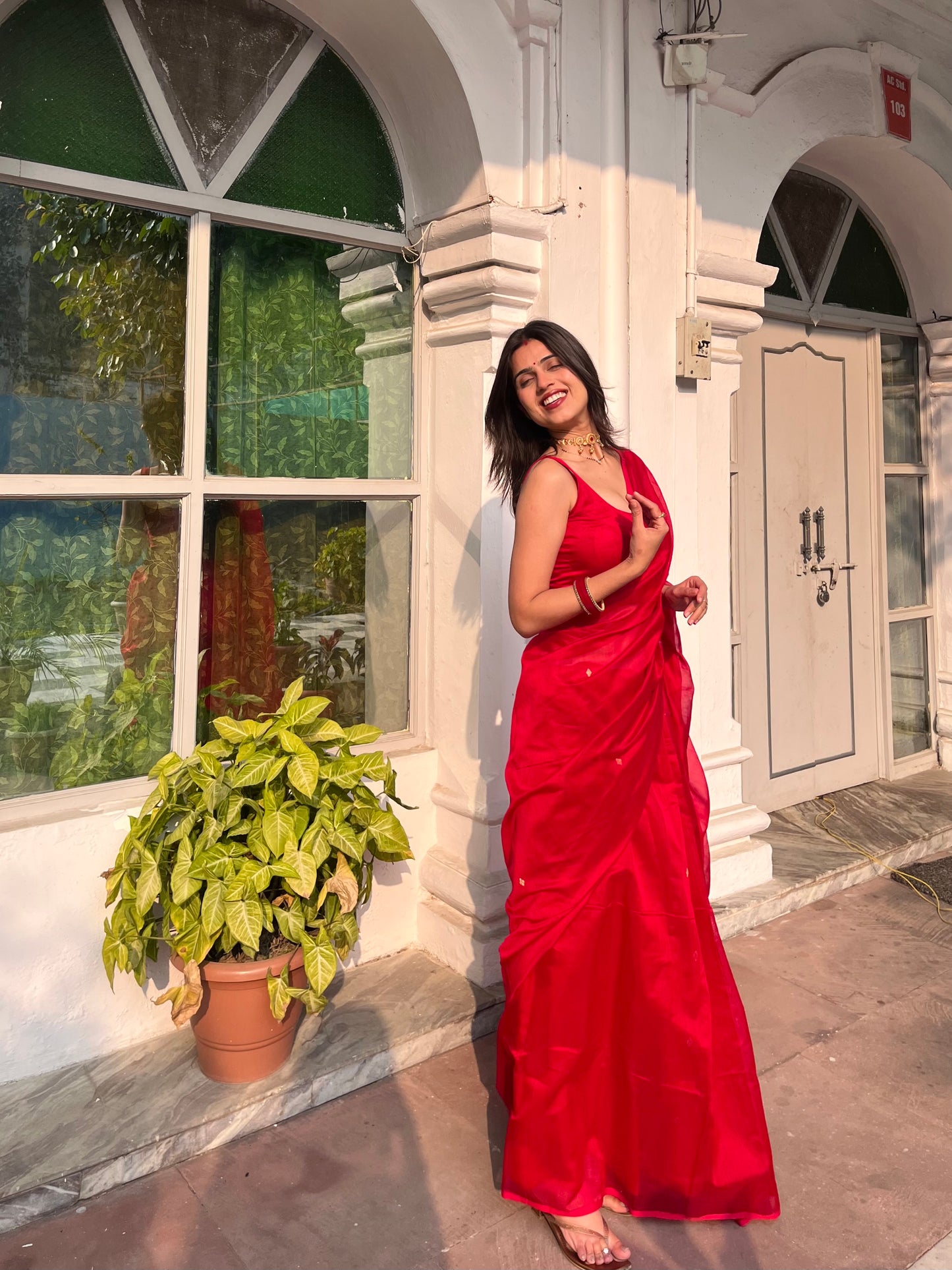Deep red maheshwari saree with zari bootis all over