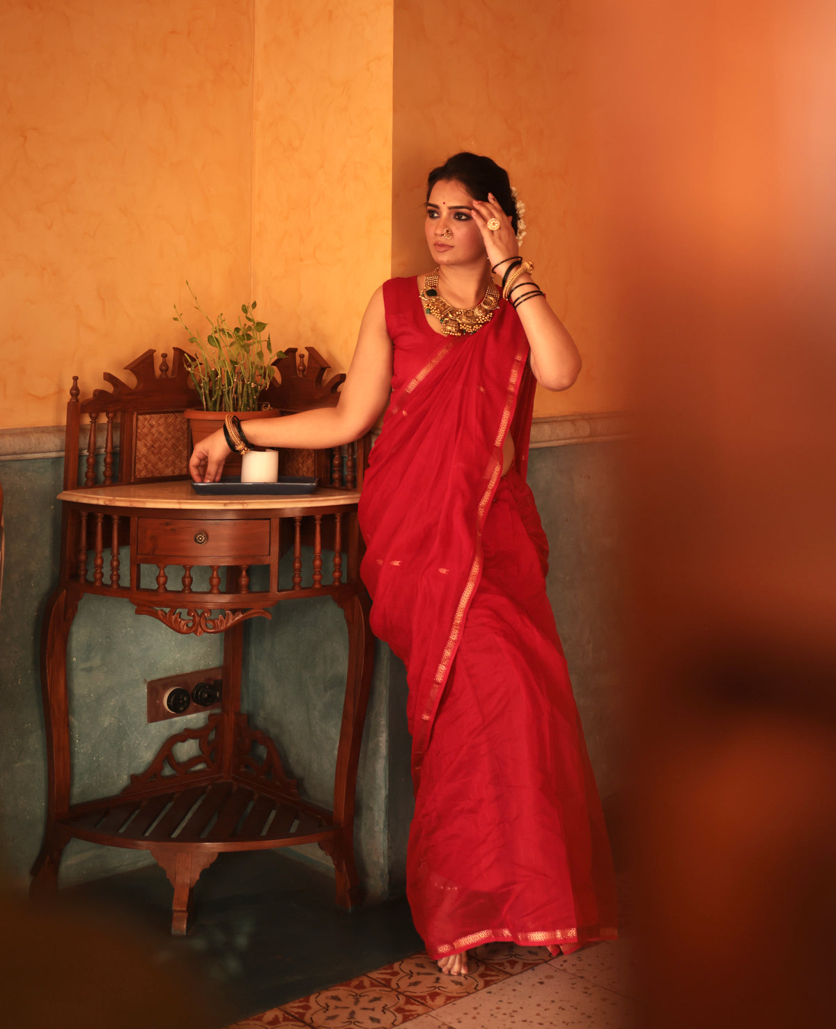 Red maheshwari saree with zari border & zari bootis all over