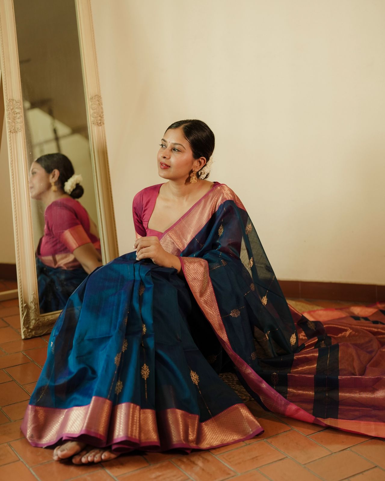 Peacock blue and pink Maheshwari saree with zari motifs all over