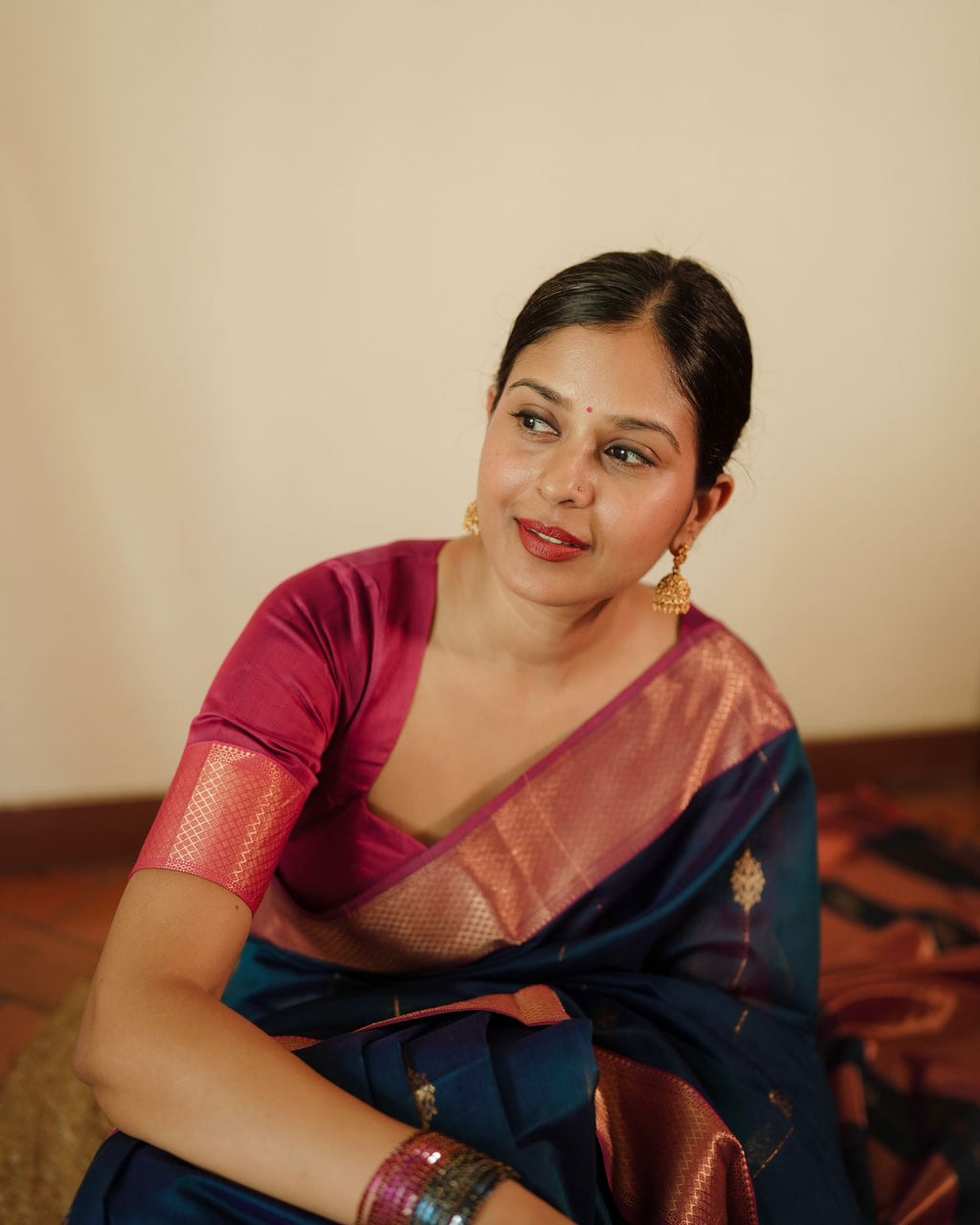 Peacock blue and pink Maheshwari saree with zari motifs all over