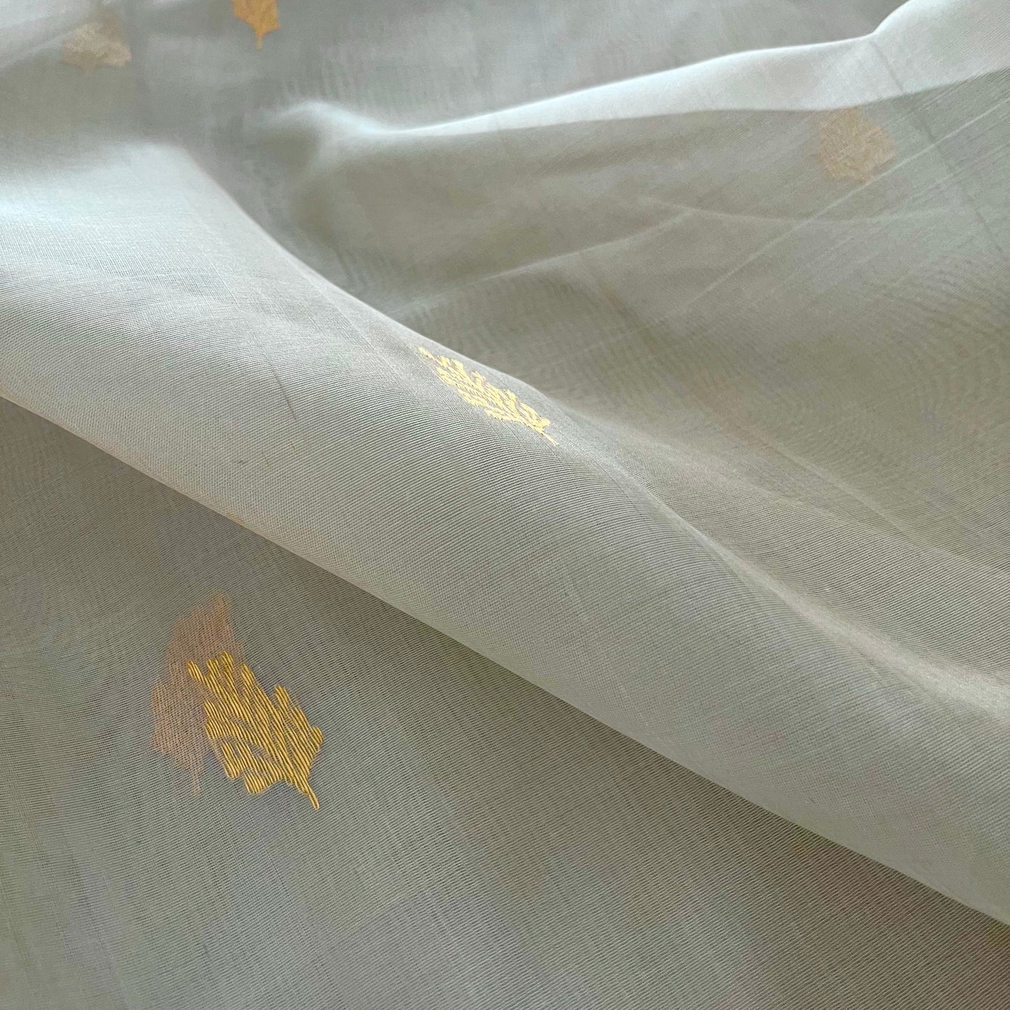 Light grey Chanderi organza silk saree with zari motifs all over