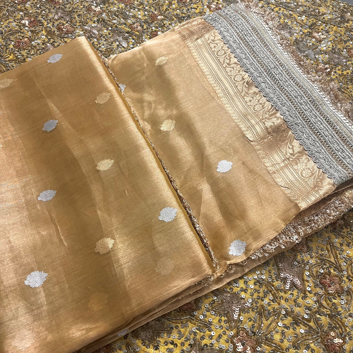 Gold Banarasi tissue silk saree with zari bootis and border