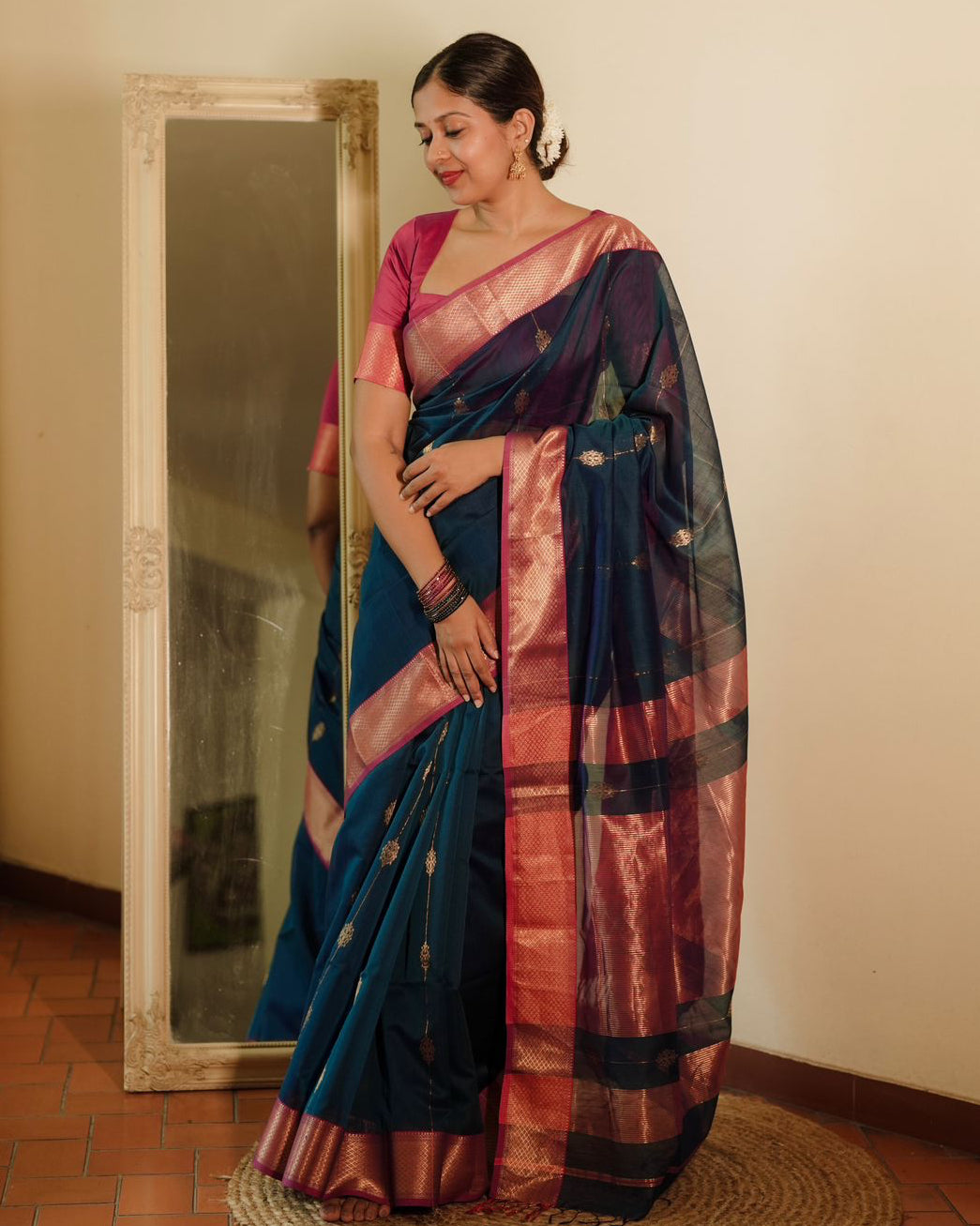 Peacock blue and pink Maheshwari saree with zari motifs all over
