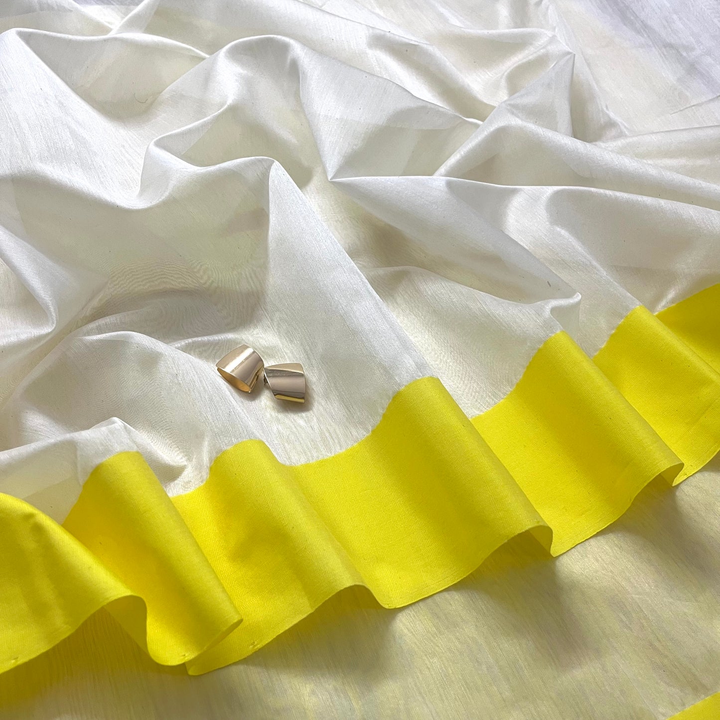 White and lemon Chanderi saree with zari lines on pallu