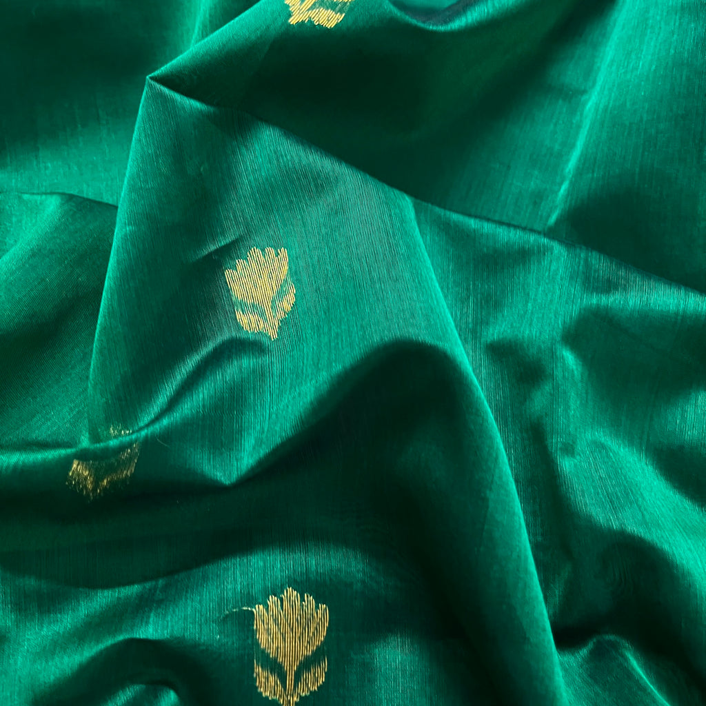 Dark green and red Maheshwari saree with flower motifs all over