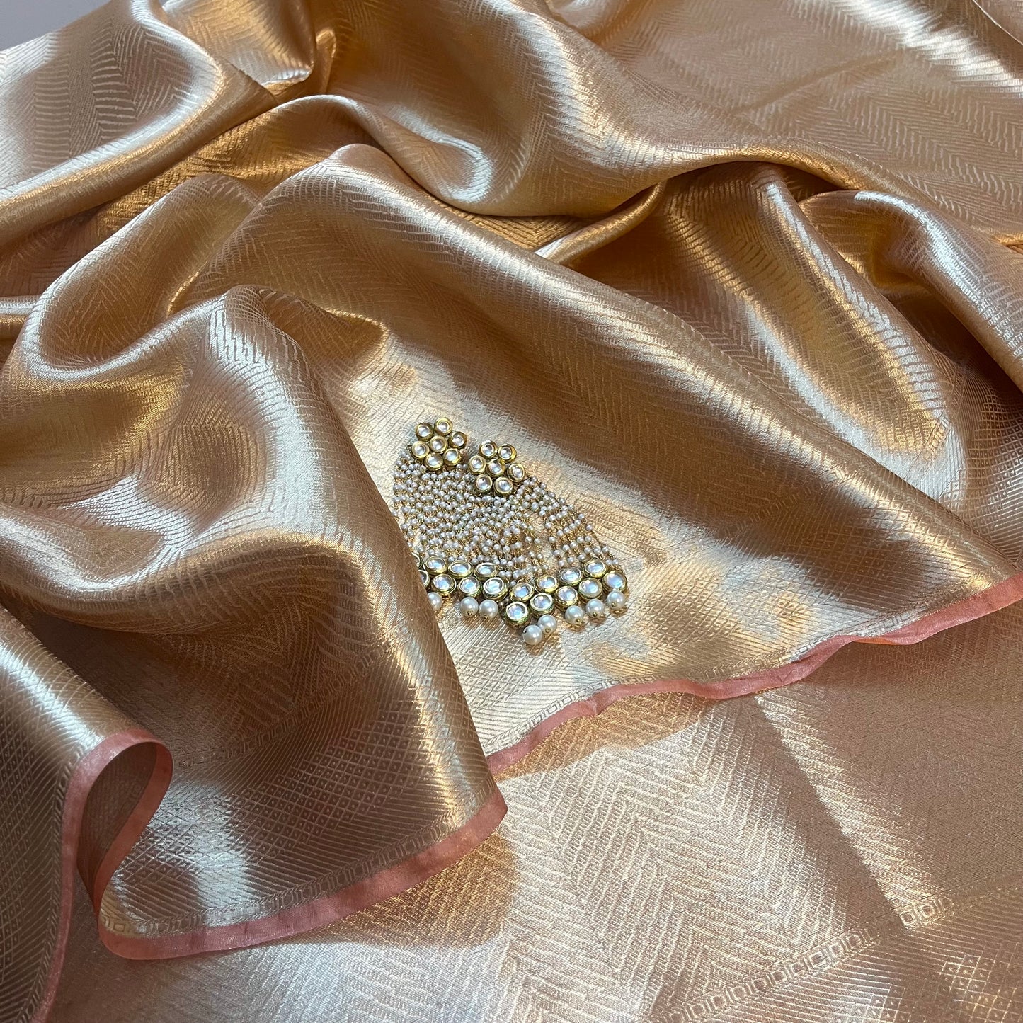 Champagne gold Banarasi silk saree with zari pattern all over