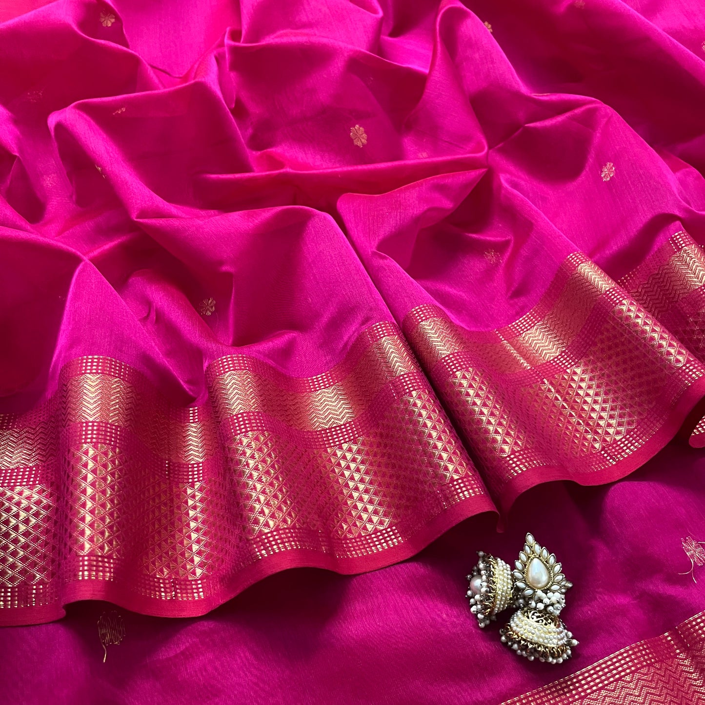 Pink Maheshwari saree with flower bootis all over