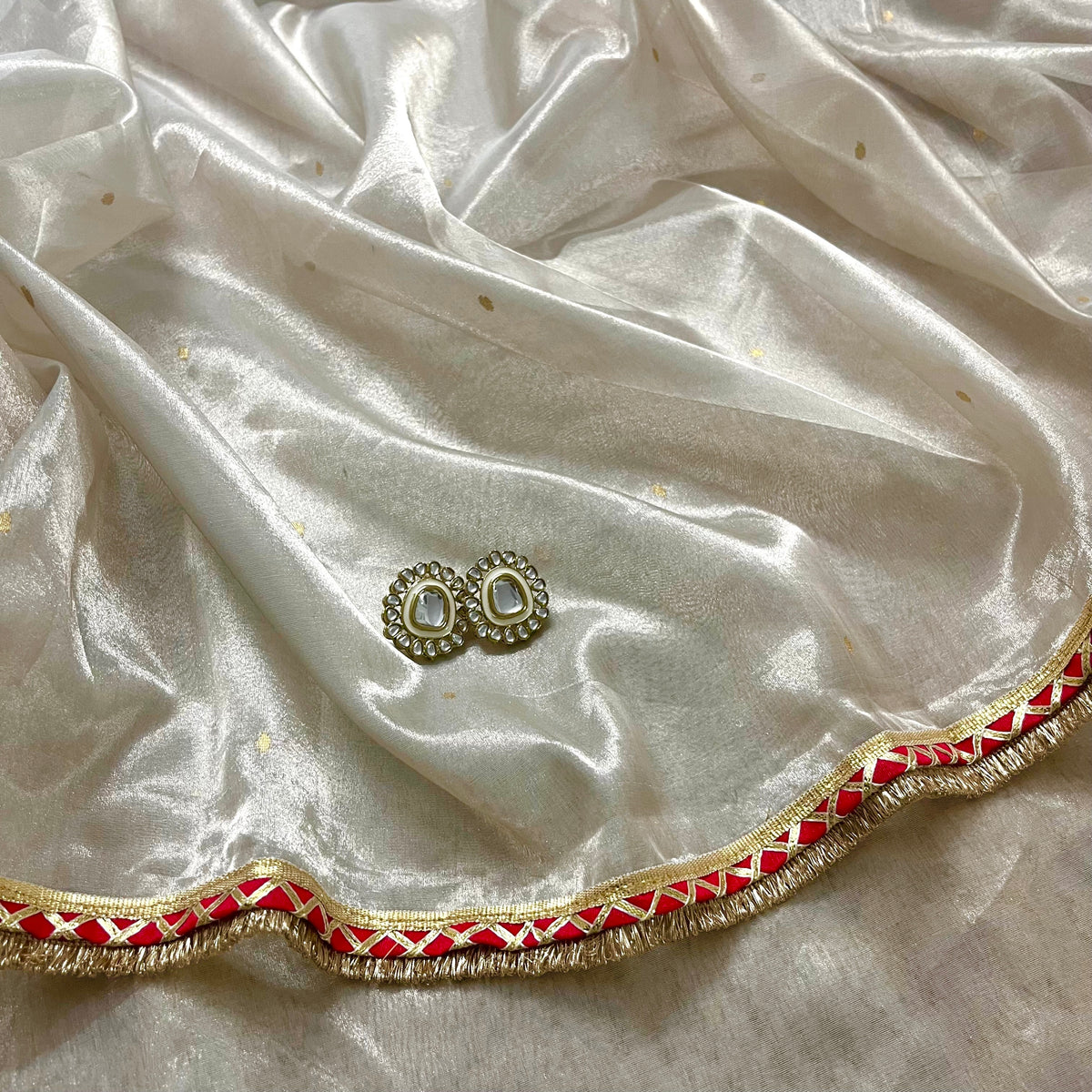 Chantilly cream and red Chanderi tissue silk saree with zari bootis all over