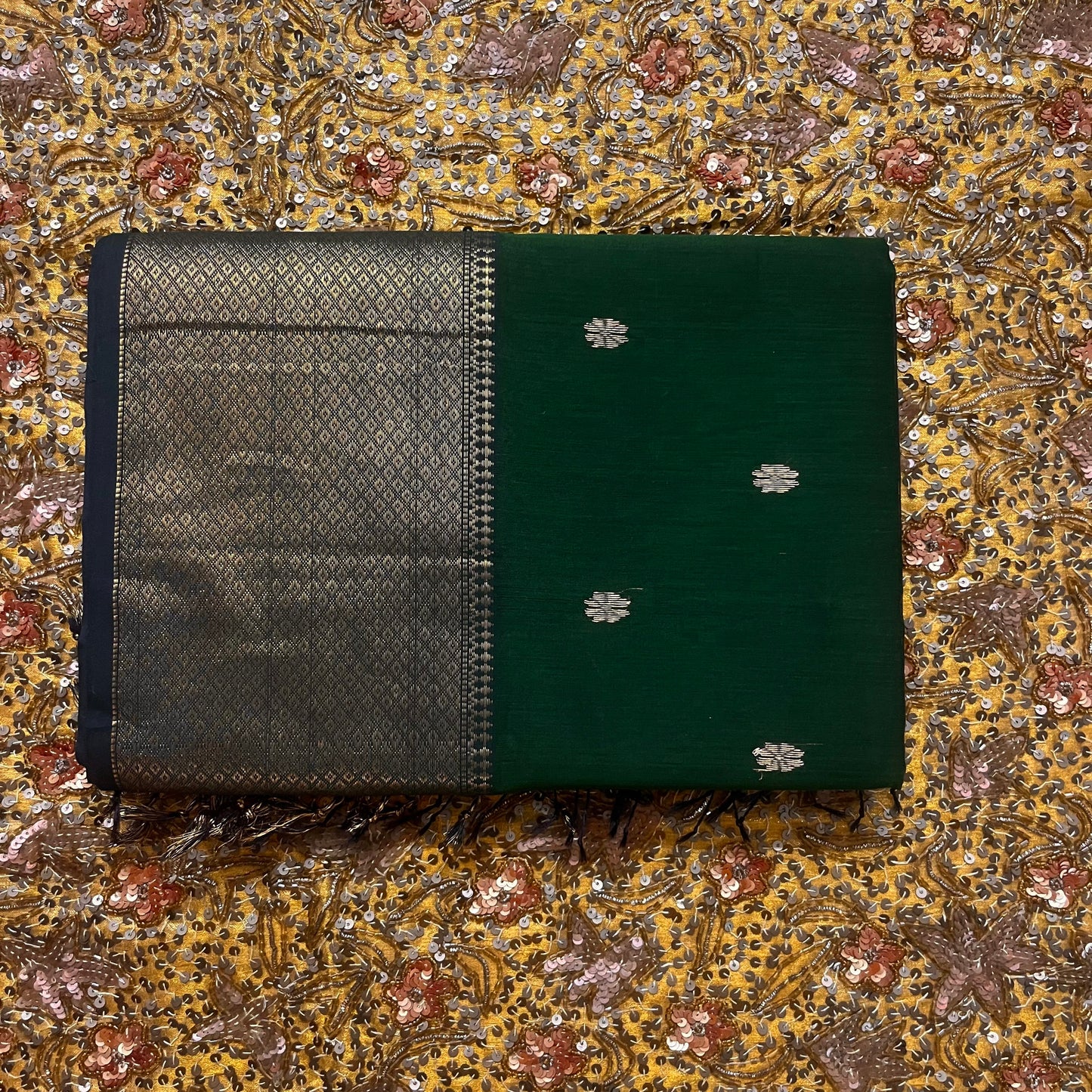Dark green maheshwari with saree with flower bootis all over