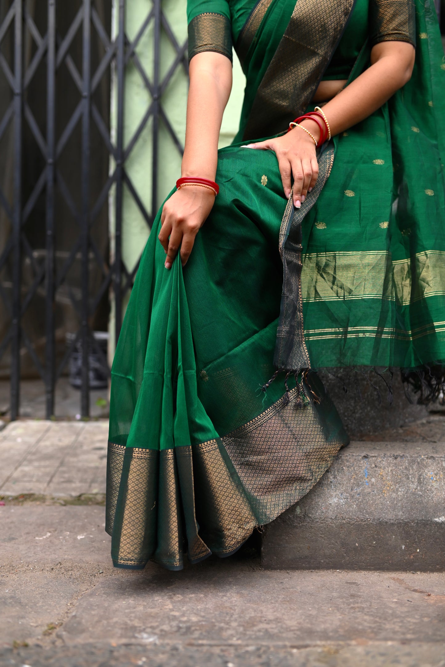 Dark green maheshwari with saree with flower bootis all over