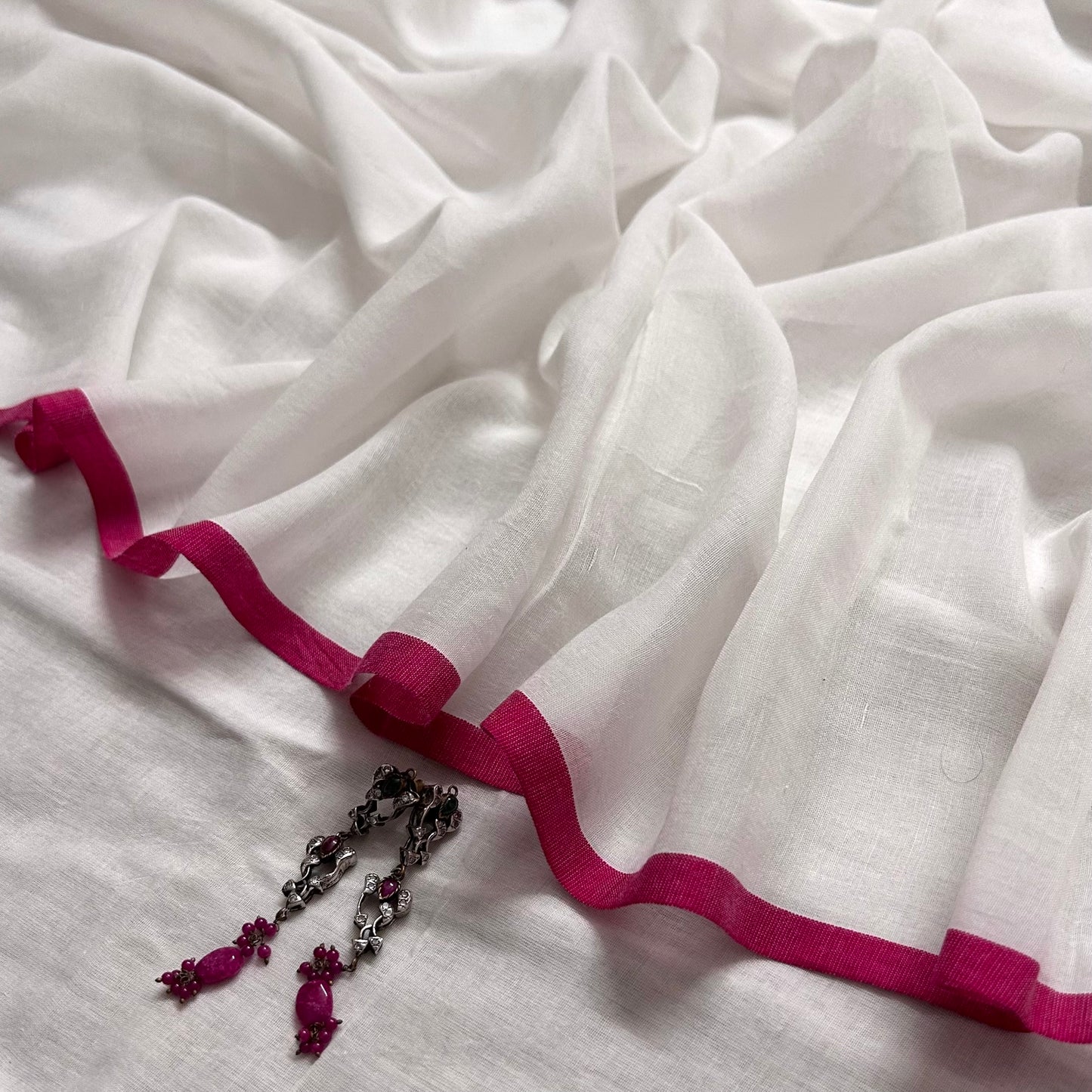 White and pink mulmul saree