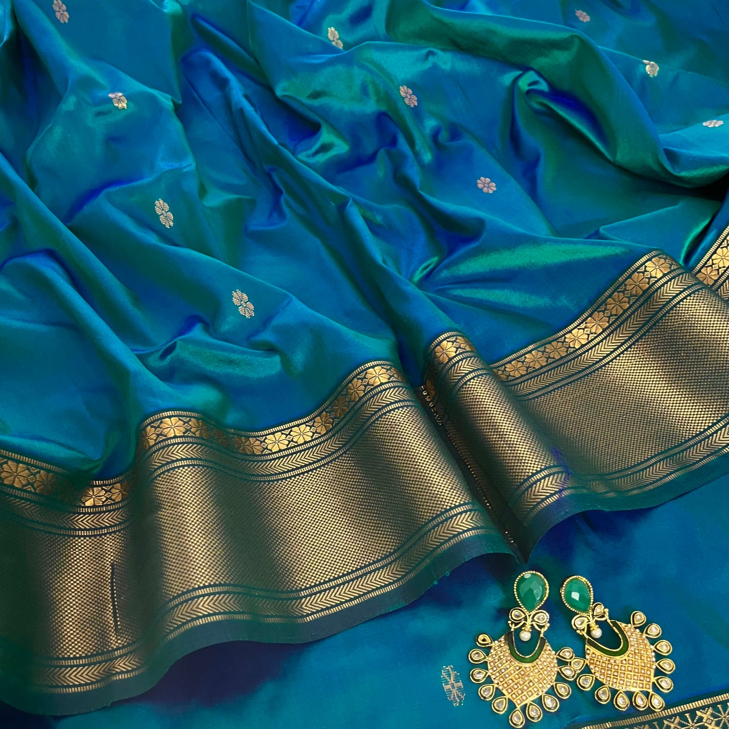 Peacock blue dual tone Maheshwari silk saree with flower bootis all over