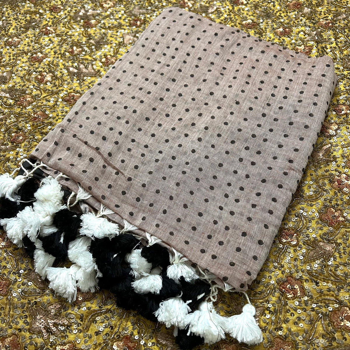 Greyish beige and black polka dot mulmul saree