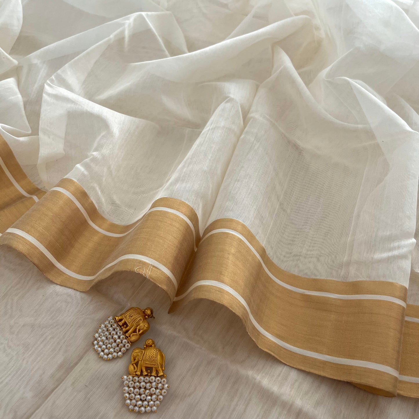 Off white Chanderi saree with zari border