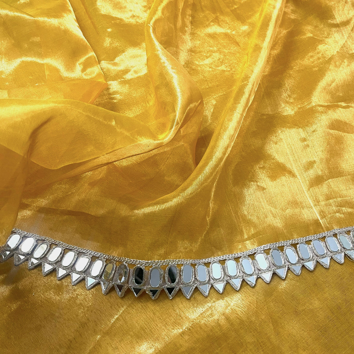 Molten amber gold chanderi tissue silk saree with mirror work border