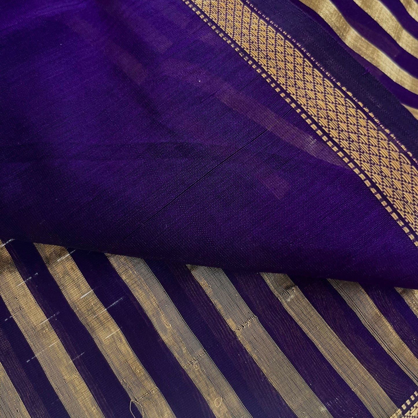 Dark purple and gold Maheshwari saree with zari stripes all over