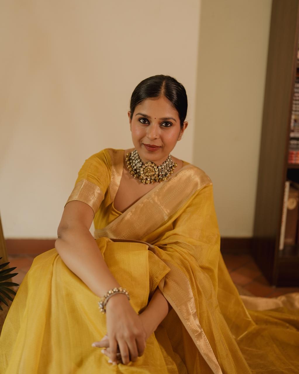 Yellow Maheshwari saree with zari lines all over