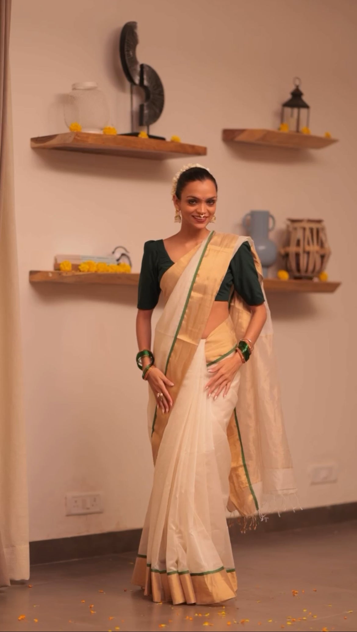 Off white and green maheshwari saree with zari lines on pallu