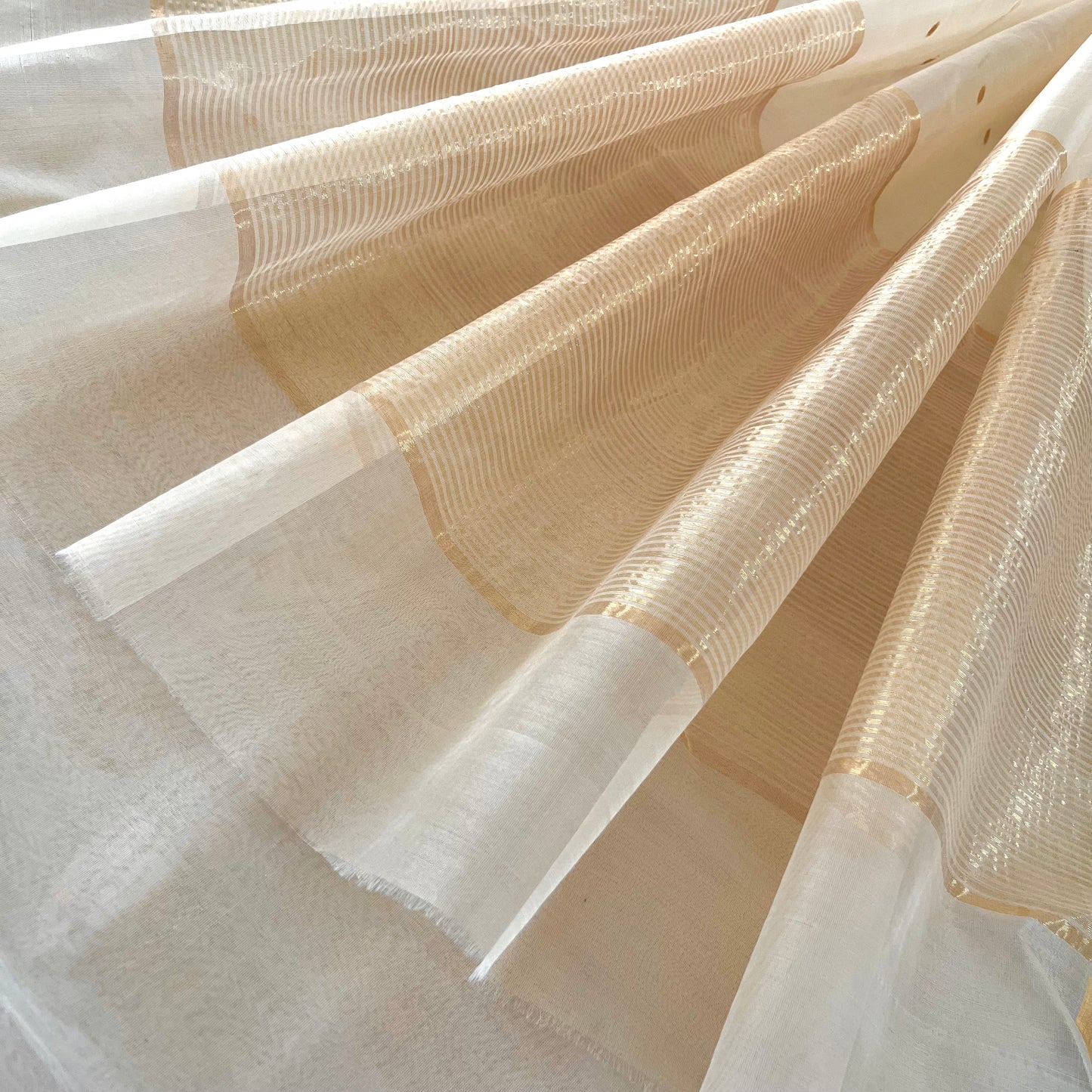 Cream Chanderi organza silk saree with zari bootis all over