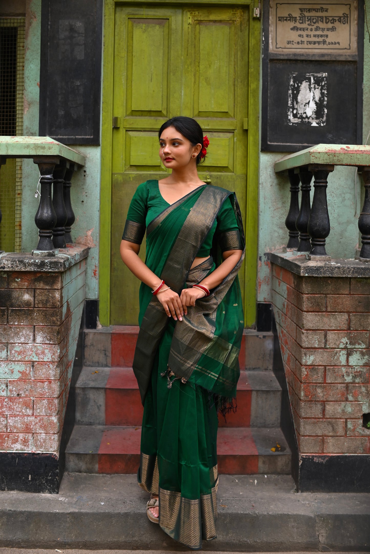 Dark green maheshwari with saree with flower bootis all over
