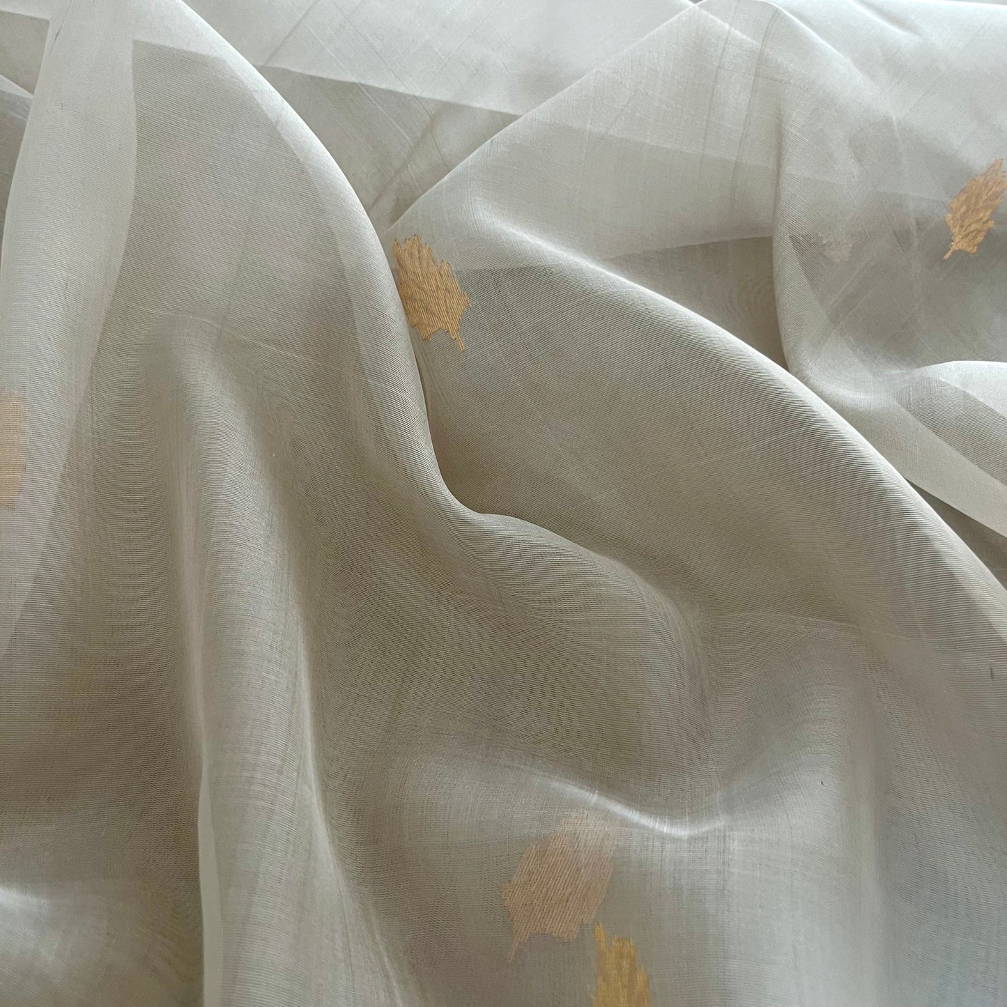 Light grey Chanderi organza silk saree with zari motifs all over