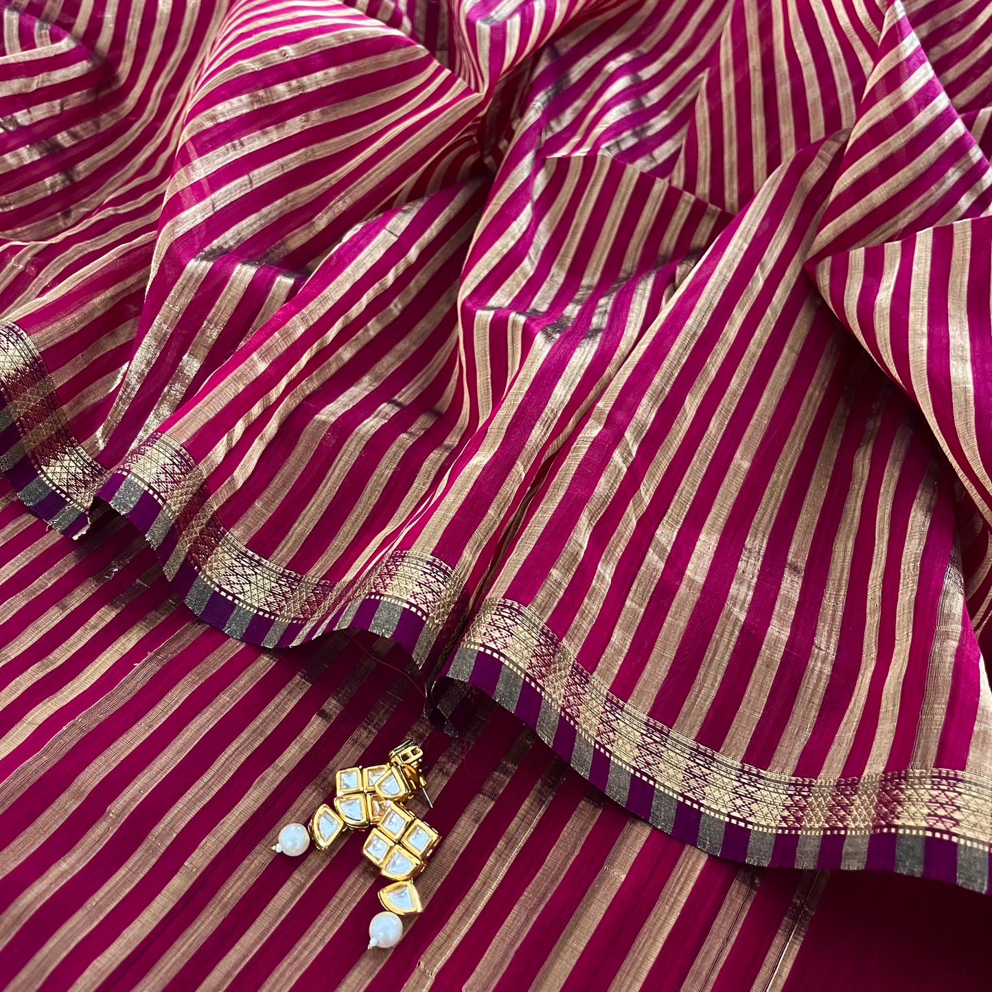 Dark pink Maheshwari saree with zari stripes all over