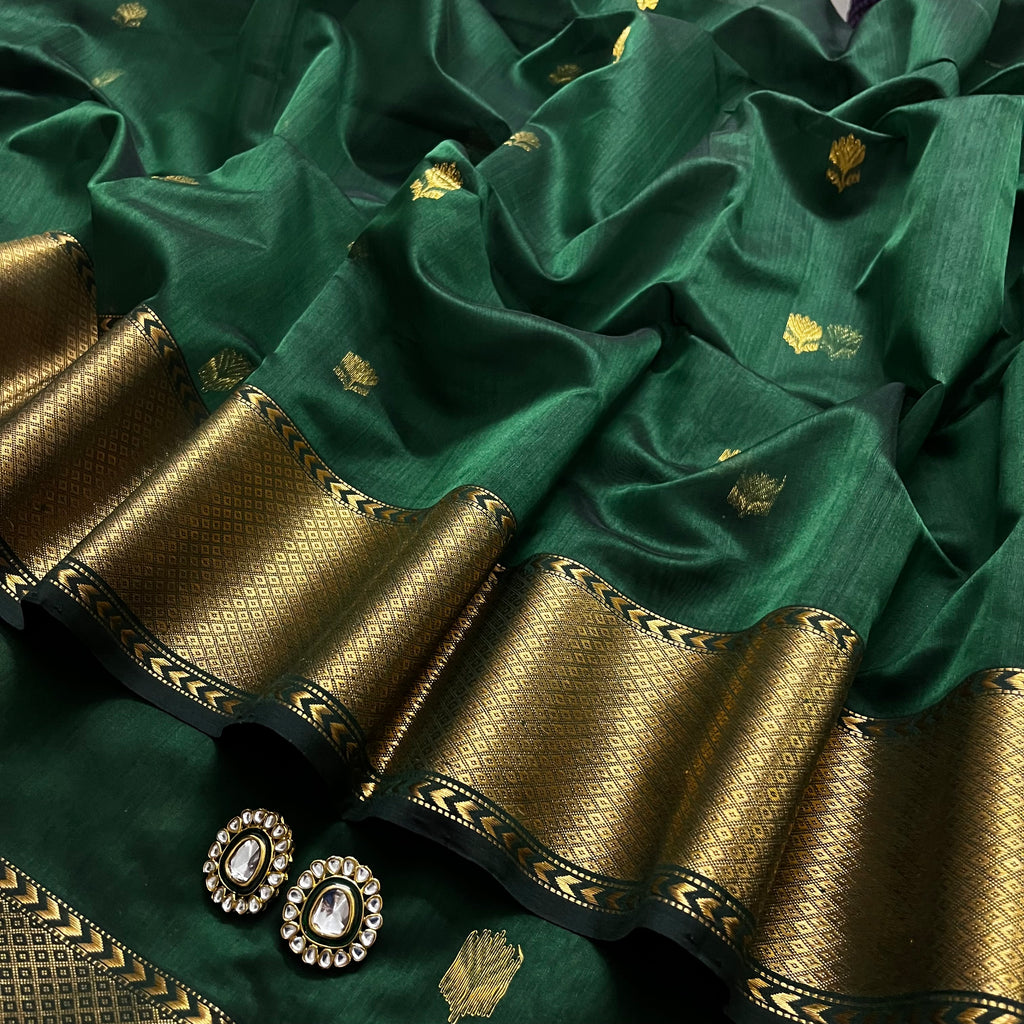 Dark green Maheshwari saree with flower motifs all over