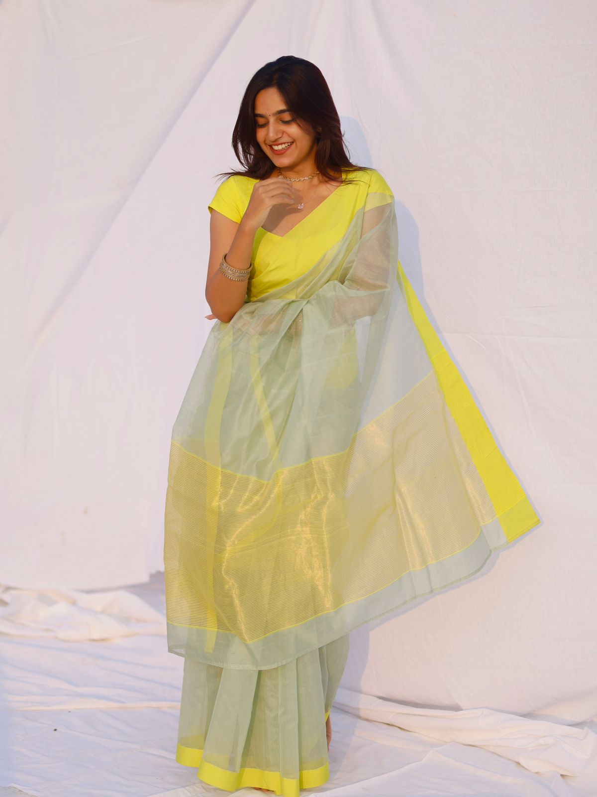 Sage and lemon Chanderi saree with zari lines on pallu