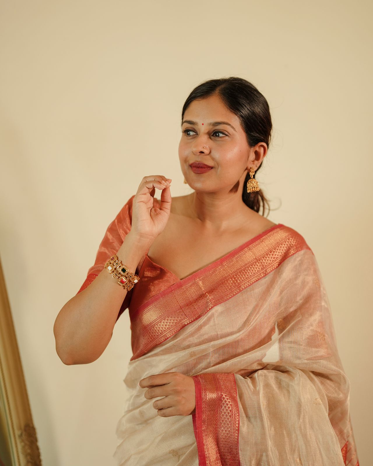 Cream and red Maheshwari tissue silk saree with zari pattern on pallu