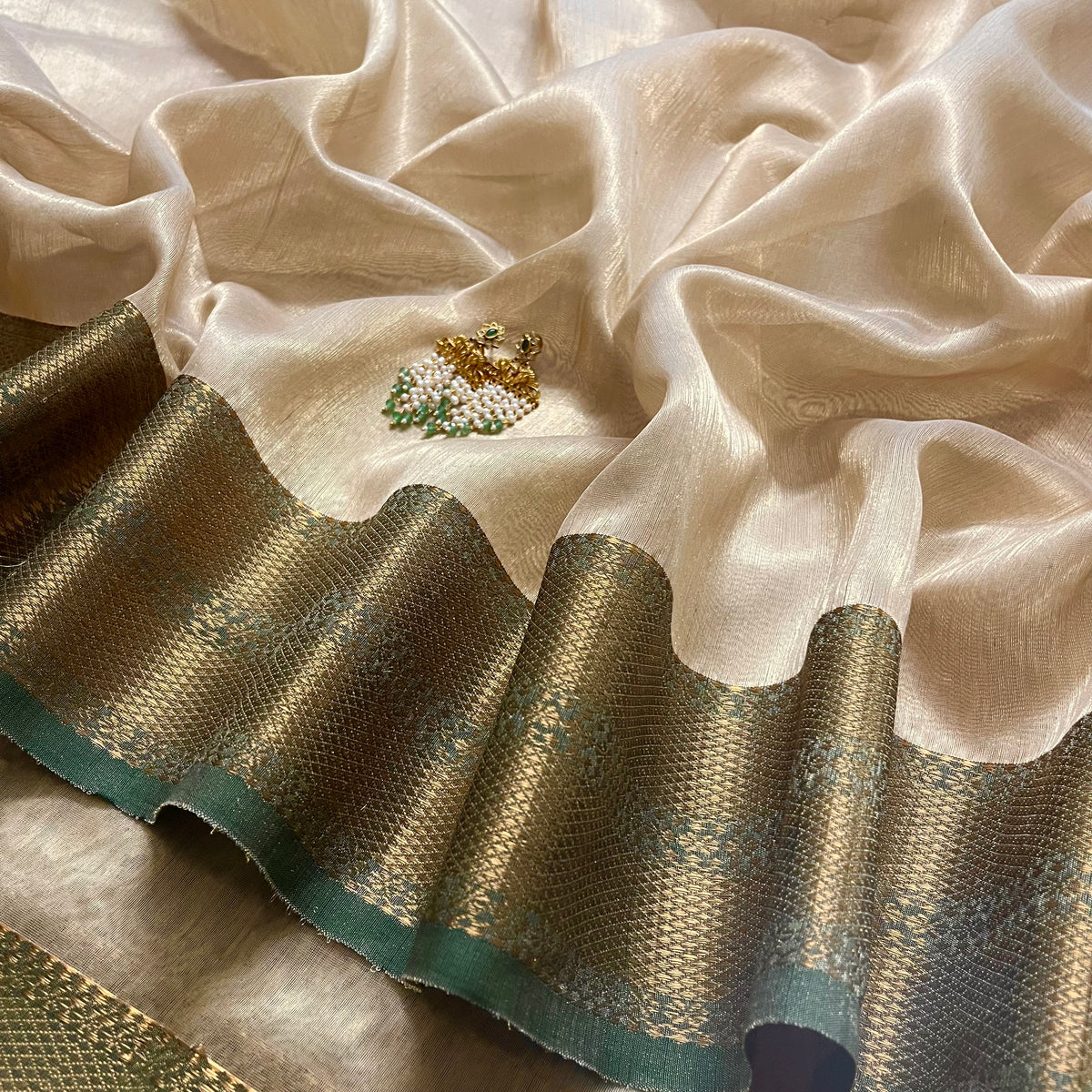 Cream Gold and green Maheshwari tissue silk saree with zari pattern on pallu