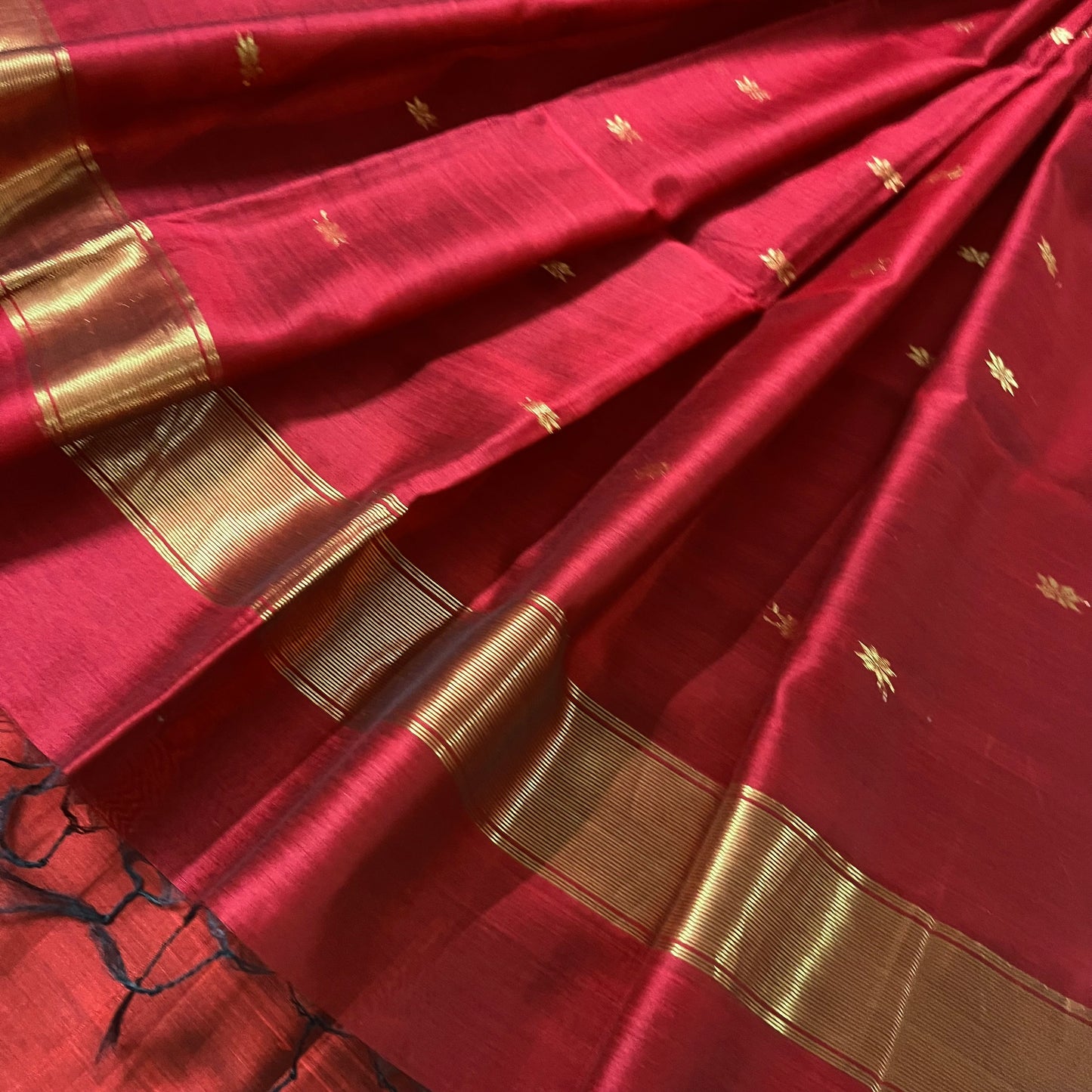Black and maroon Maheshwari saree with flower bootis all over