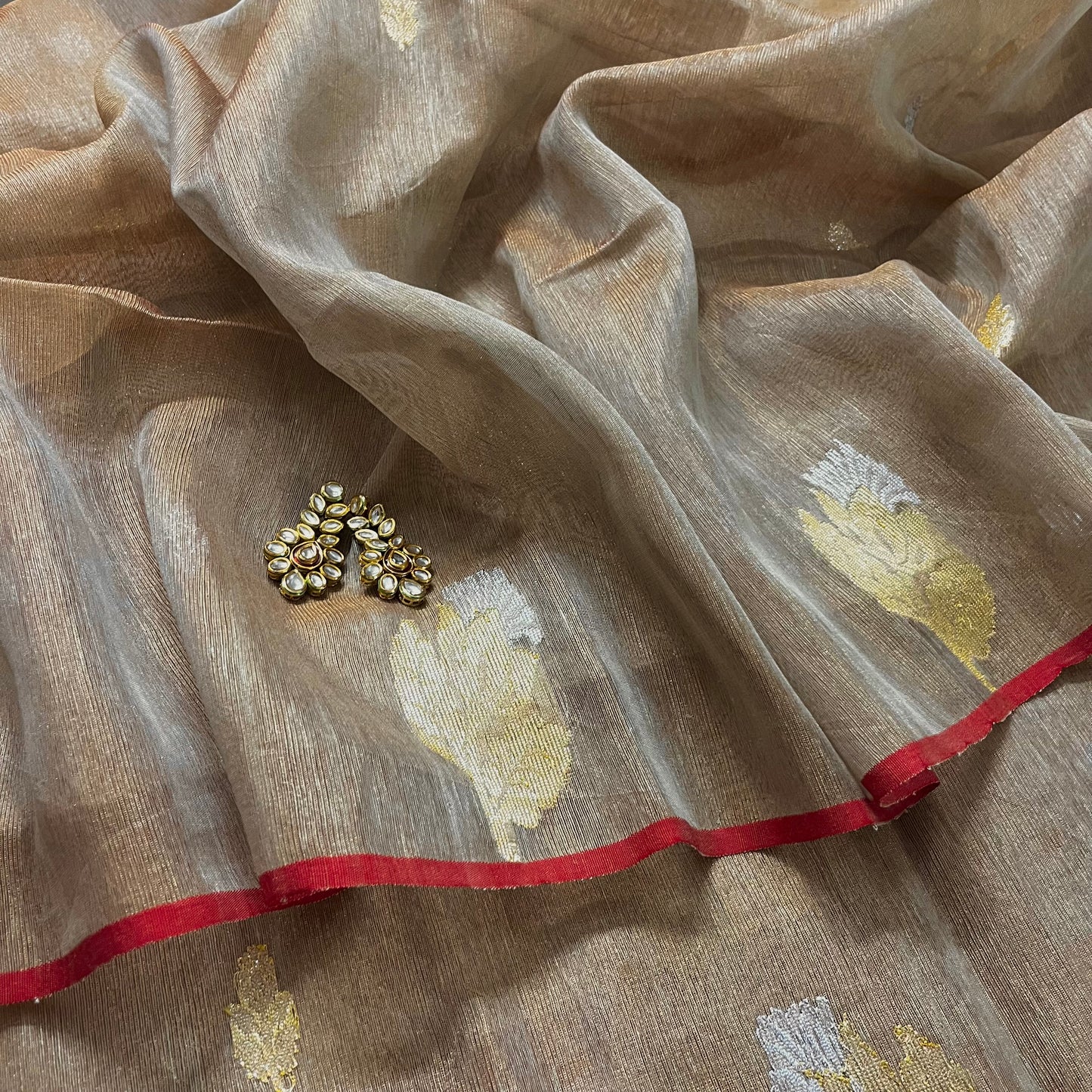 Beige and red linen saree with zari motifs all over