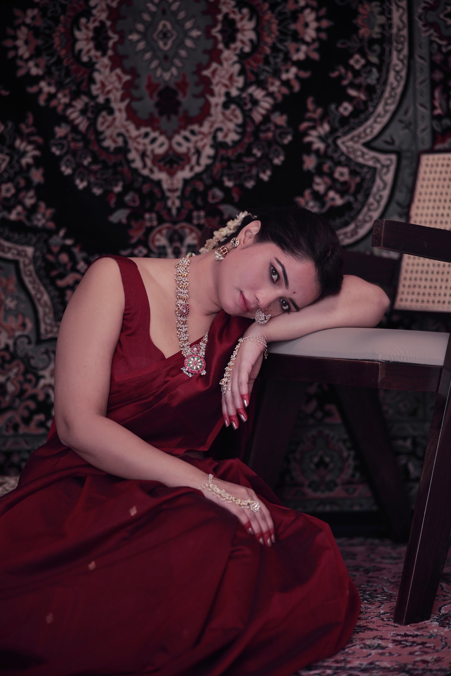 Deep maroon Maheshwari saree with zari bootis all over