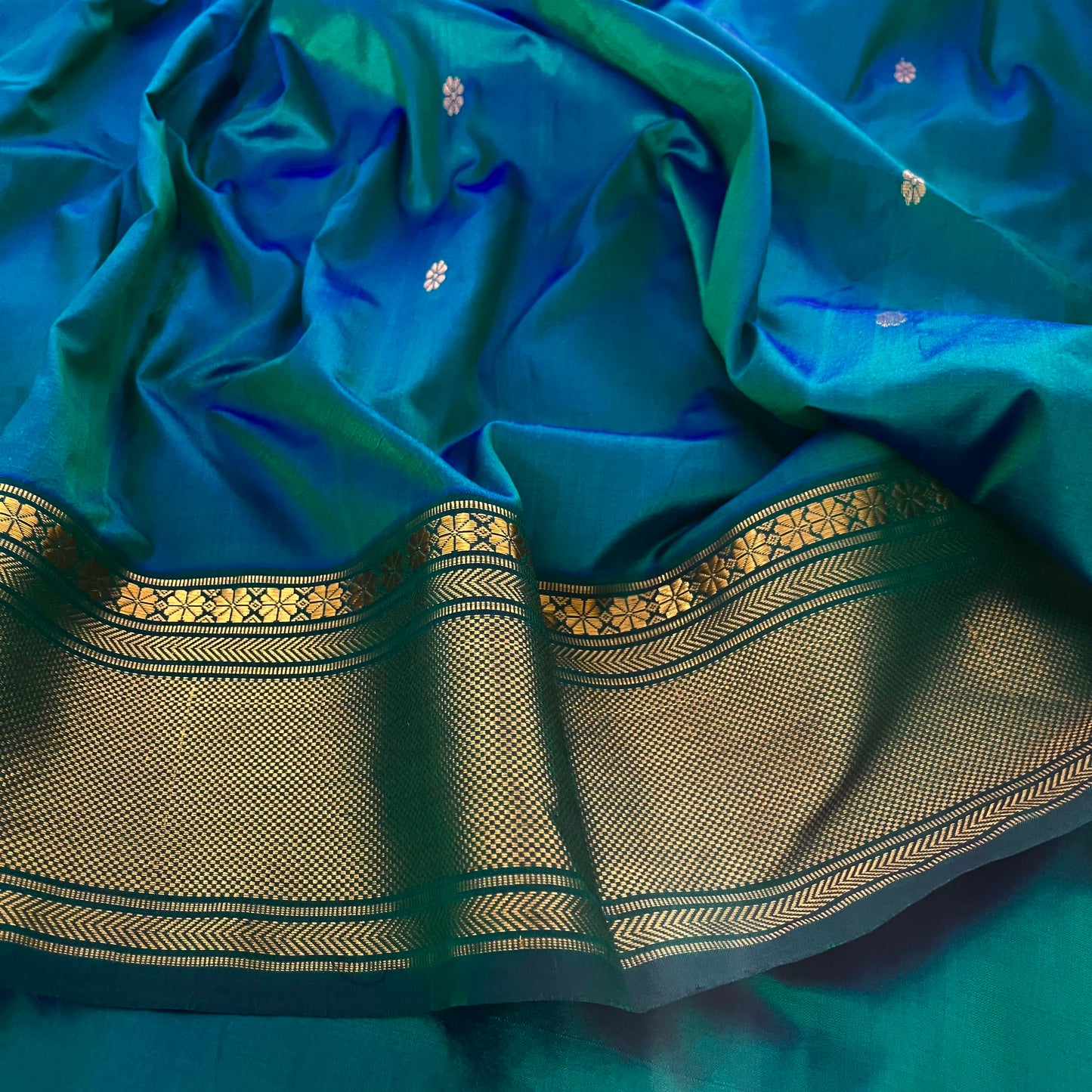 Peacock blue dual tone Maheshwari silk saree with flower bootis all over
