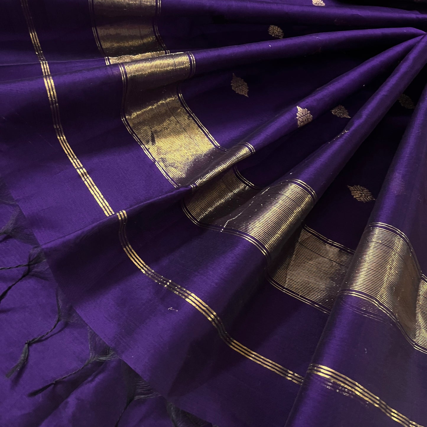 Dark purple Maheshwari saree with dori flower bootis all over