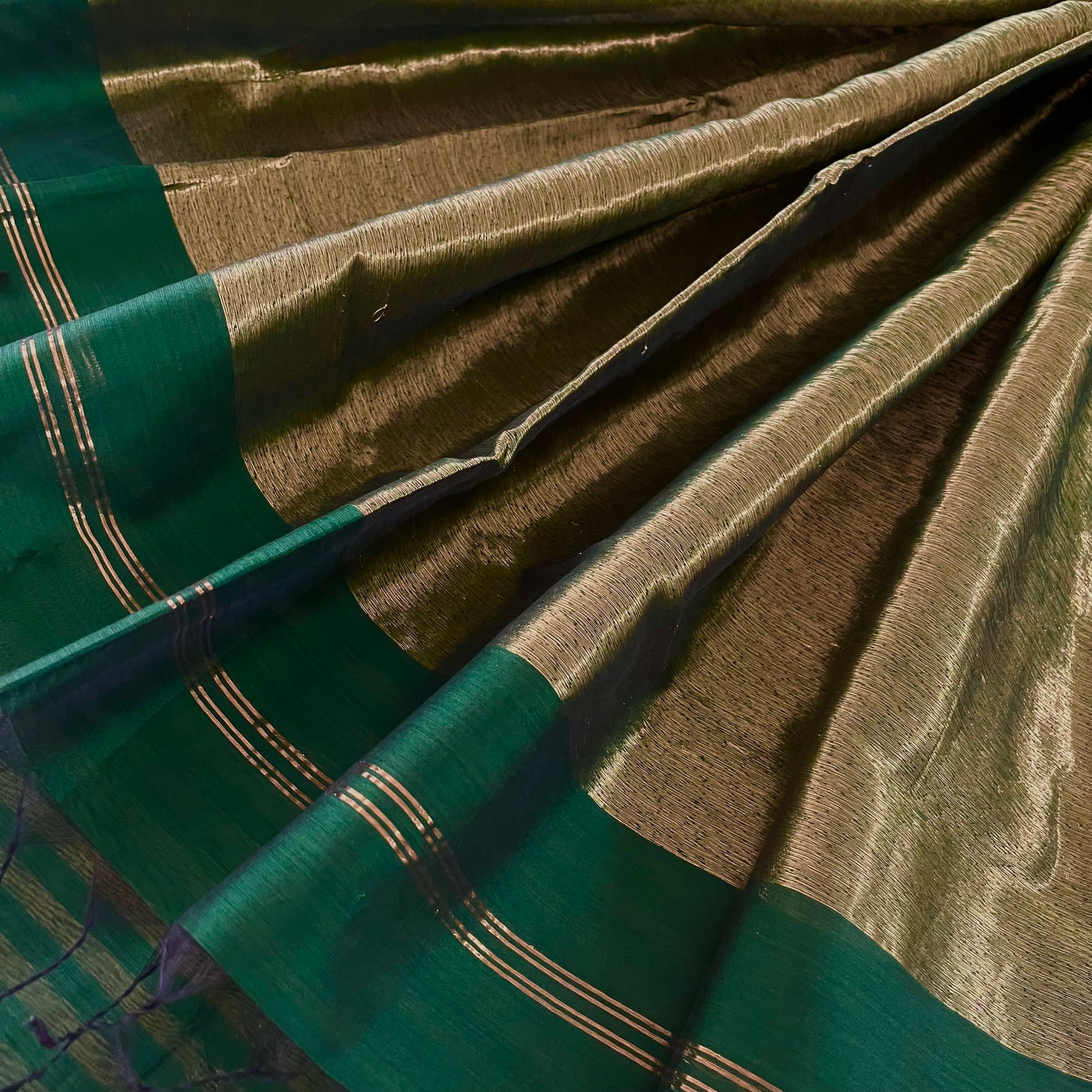 Dark green Maheshwari saree with zari stripes all over