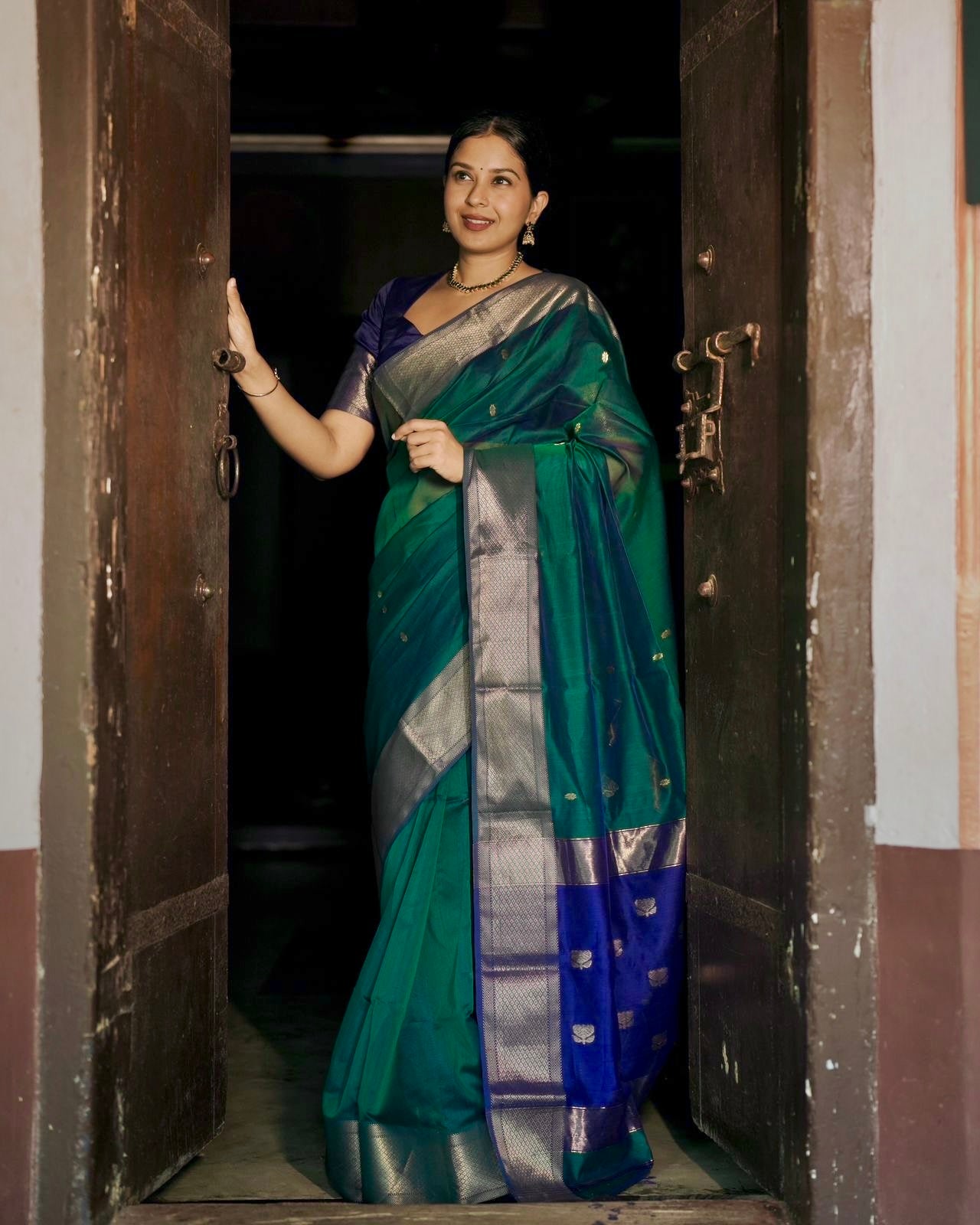 Dark Green and blue maheshwari dual tone saree with flower bootis all over