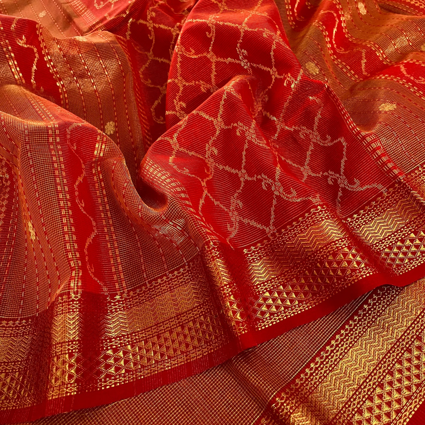 Red and gold Maheshwari silk saree with zari jaal work on pallu