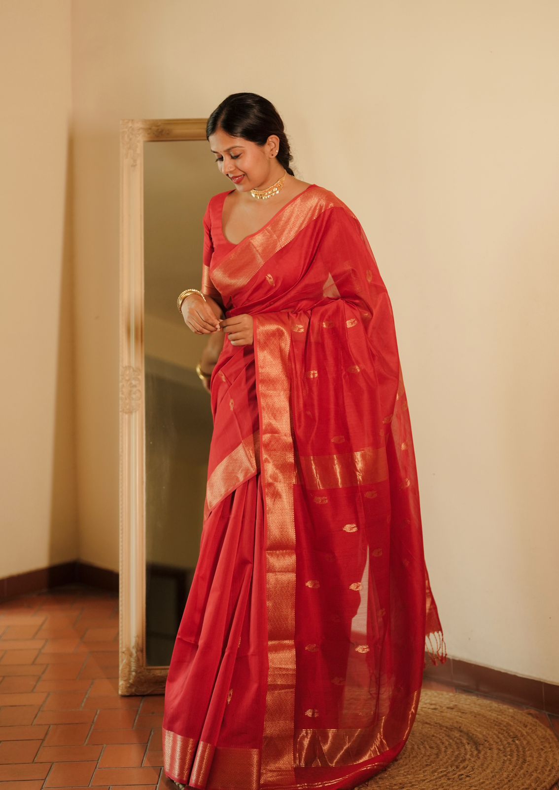 Red Maheshwari saree with morni motifs all over