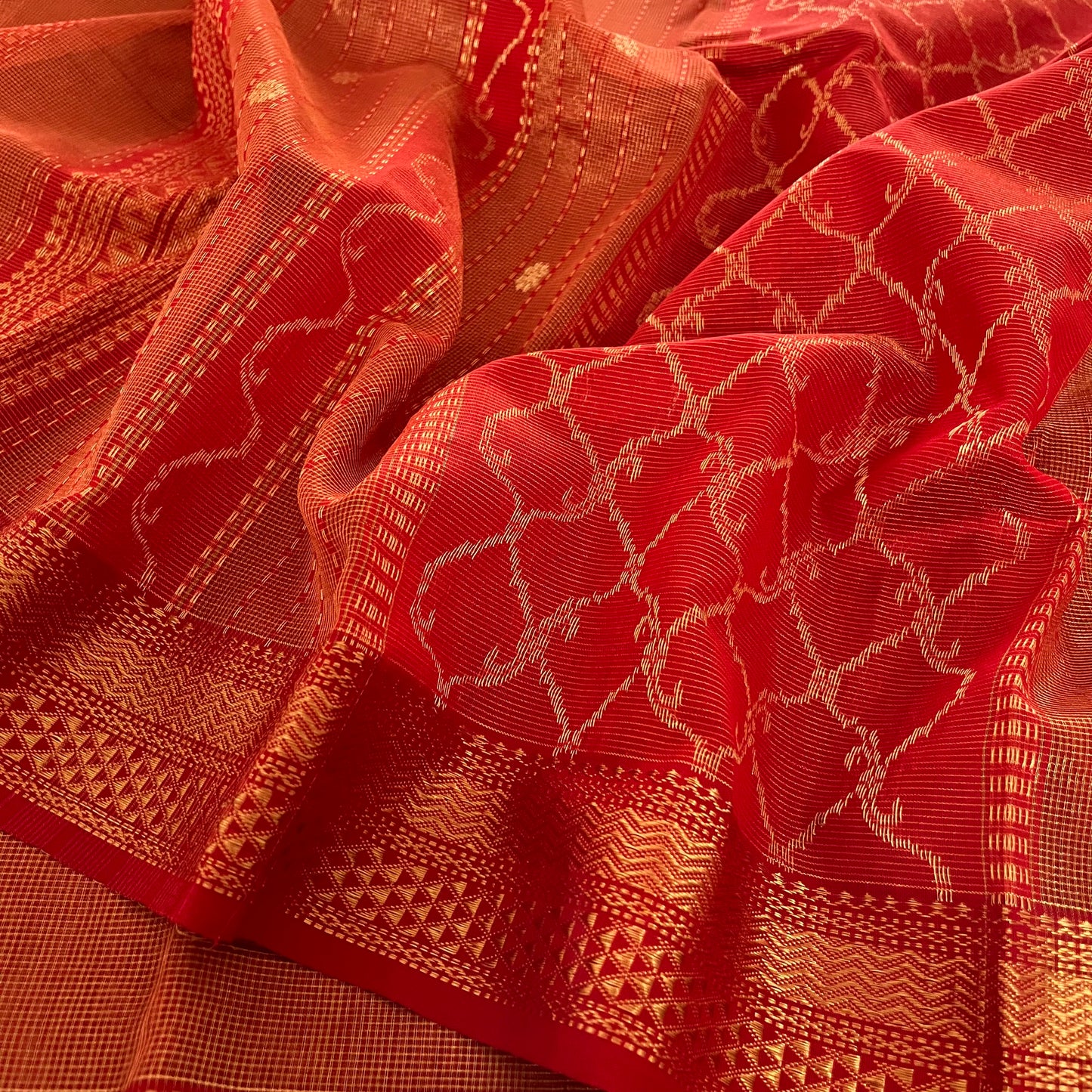 Red and gold Maheshwari silk saree with zari jaal work on pallu