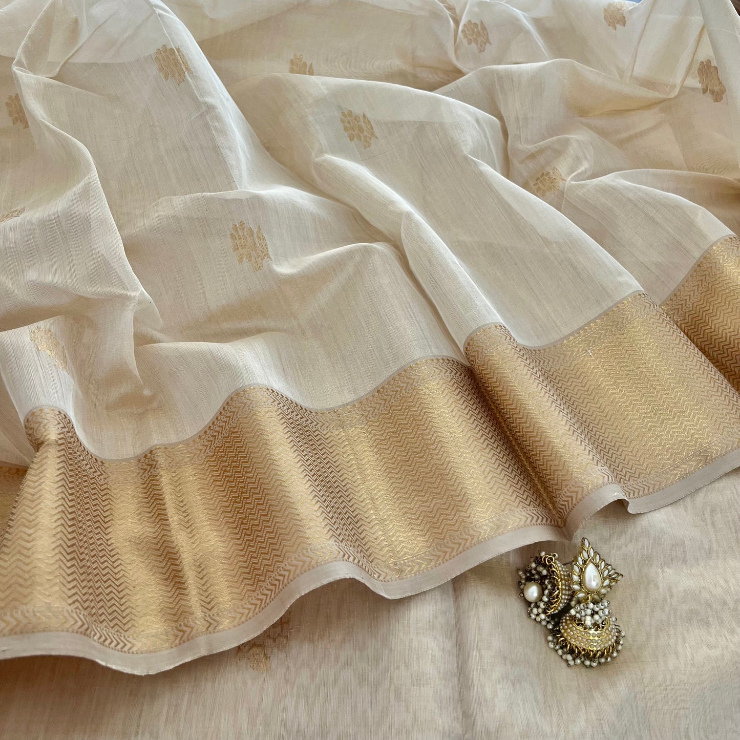 Cream gold Maheshwari tissue silk saree with flower motifs all over