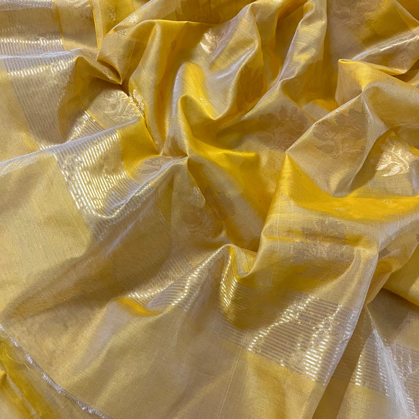 Mustard yellow Chanderi saree with zari bootis all over and flower motifs on pallu